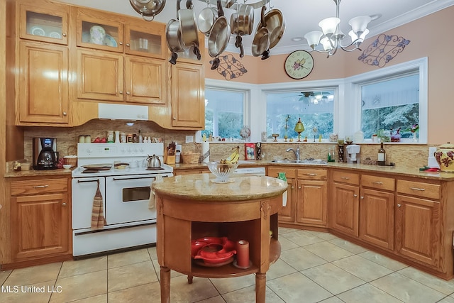 kitchen with sink, backsplash, pendant lighting, white electric range, and ornamental molding