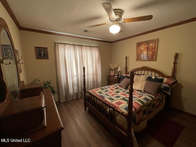 bedroom with a textured ceiling, hardwood / wood-style flooring, ceiling fan, and ornamental molding