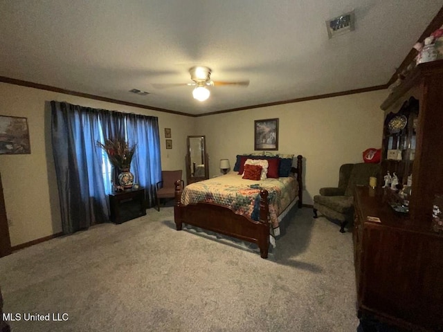 carpeted bedroom featuring ceiling fan, ornamental molding, and a textured ceiling