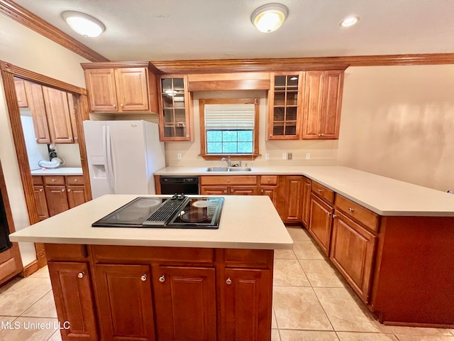 kitchen featuring sink, black appliances, a center island, and ornamental molding