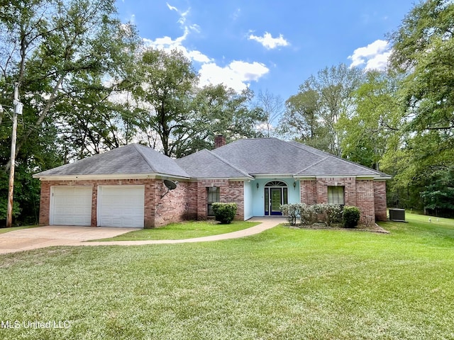 ranch-style house with a front yard, central AC unit, and a garage