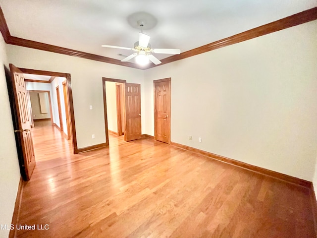 unfurnished bedroom featuring light hardwood / wood-style floors, crown molding, and ceiling fan