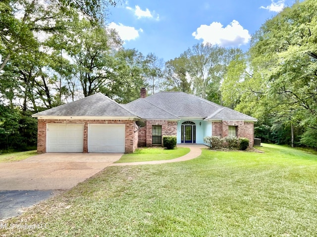 single story home featuring a front yard and a garage