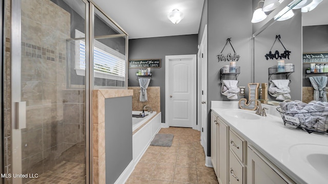 bathroom with vanity, independent shower and bath, and tile patterned flooring