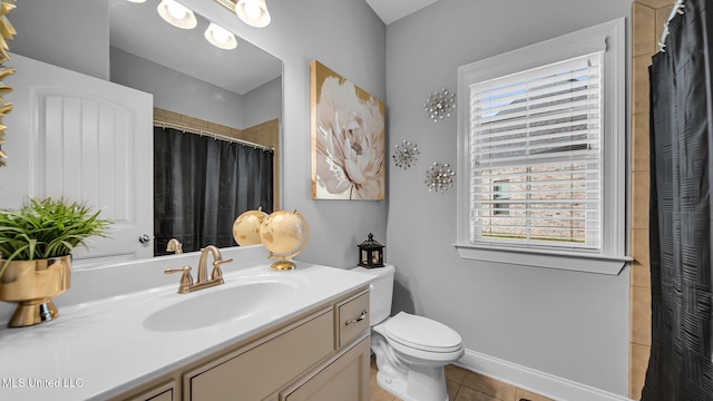 bathroom featuring vanity, curtained shower, toilet, and tile patterned floors