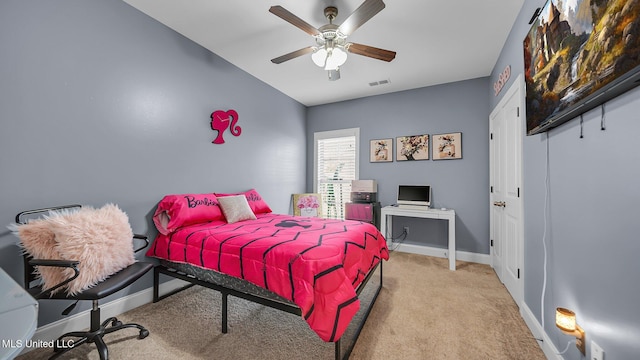 bedroom featuring ceiling fan and light colored carpet