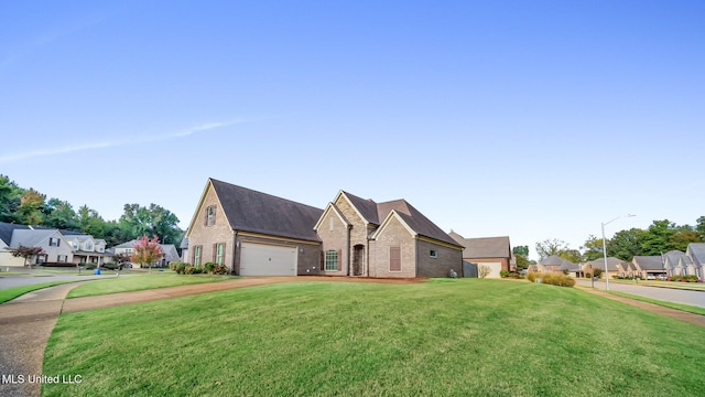 view of front facade featuring a front yard and a garage