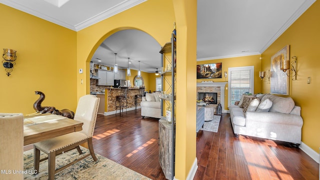 dining space with crown molding and dark hardwood / wood-style floors