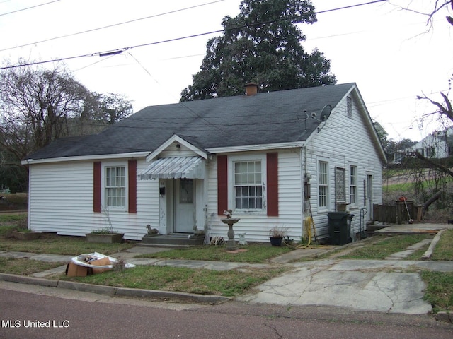 bungalow-style house with entry steps