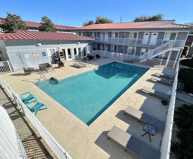 view of swimming pool featuring a patio area