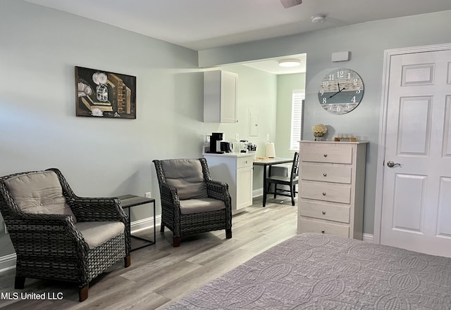 living area with light hardwood / wood-style flooring