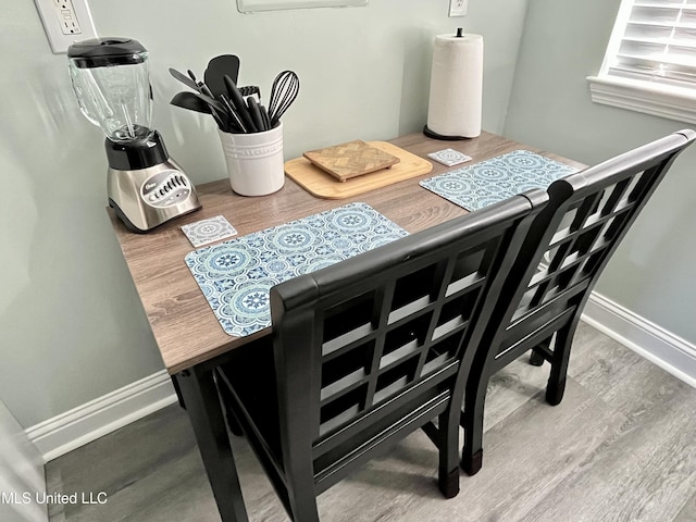 dining space featuring hardwood / wood-style floors