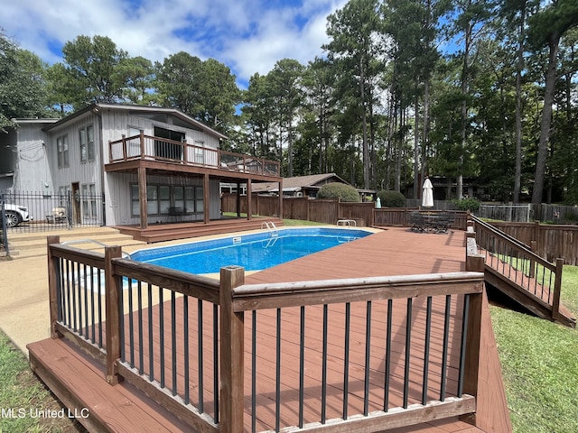 view of pool with a deck