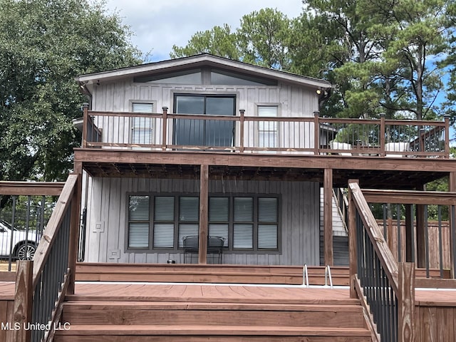 back of house featuring a deck