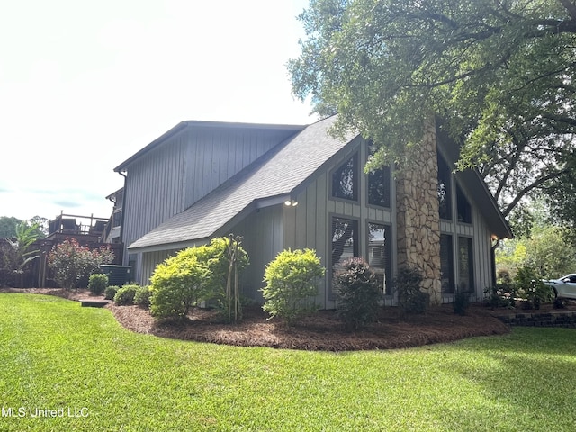 view of property exterior with a yard