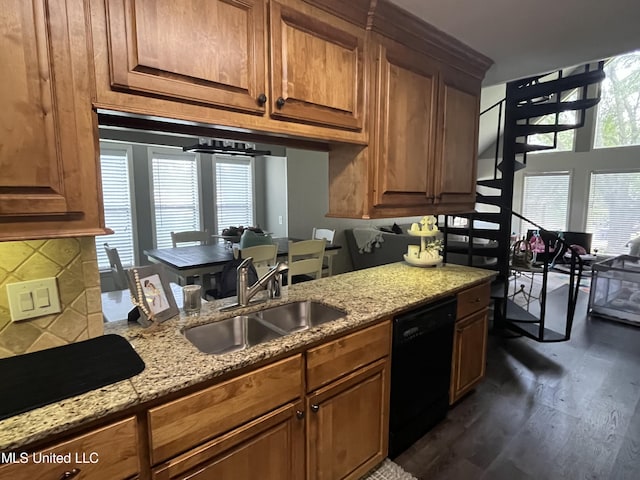 kitchen with dishwasher, sink, plenty of natural light, and dark hardwood / wood-style floors