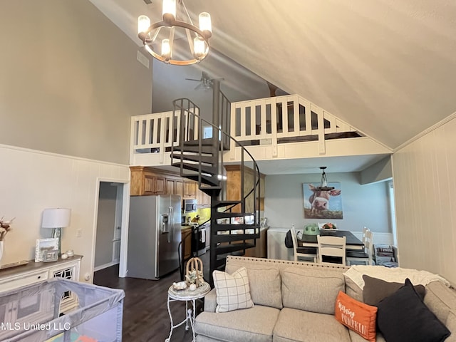 living room featuring wooden walls, a notable chandelier, high vaulted ceiling, and dark hardwood / wood-style flooring