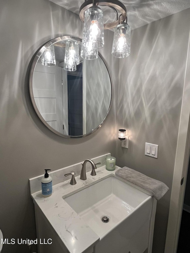 bathroom featuring vanity and a textured ceiling