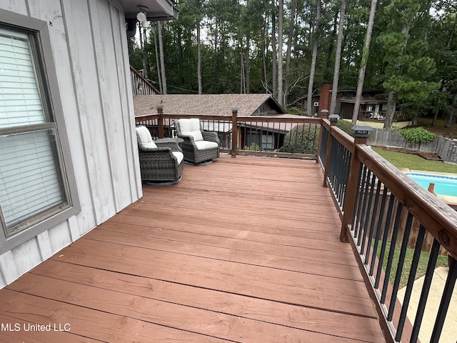 wooden deck with a pool