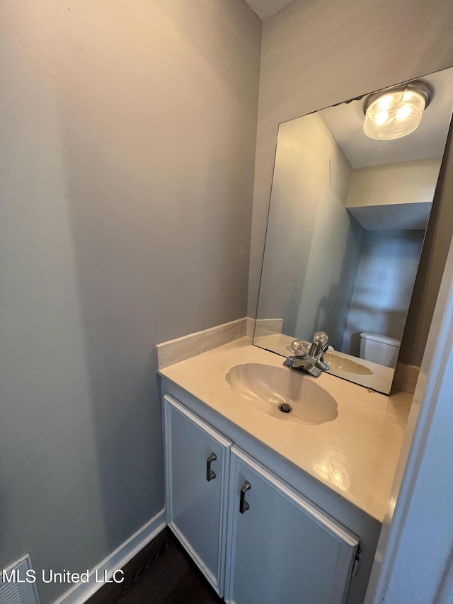 bathroom with vanity and toilet