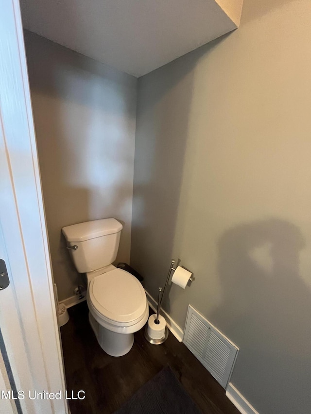 bathroom featuring toilet and hardwood / wood-style floors