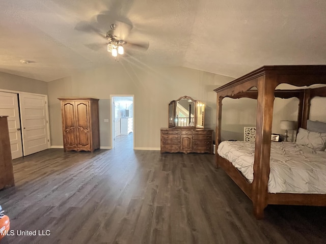 bedroom with lofted ceiling, dark hardwood / wood-style floors, and ceiling fan