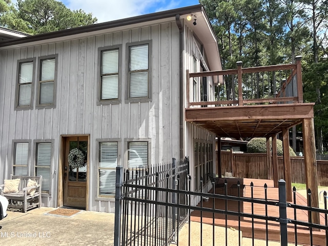 view of front of property with a patio area and a deck