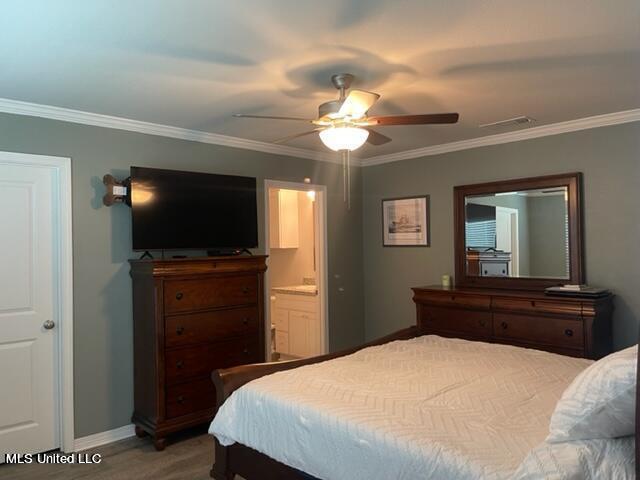 bedroom with connected bathroom, ceiling fan, and ornamental molding