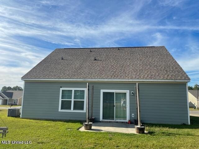 back of house featuring a yard, a patio area, and central AC unit