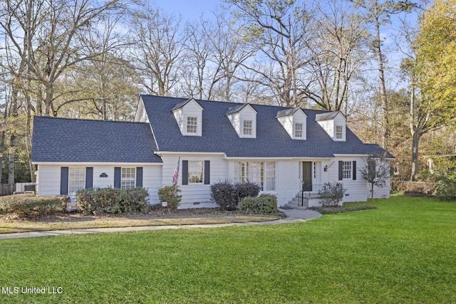 cape cod home with a front lawn