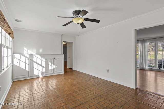 unfurnished room featuring ceiling fan and crown molding