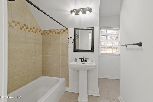 bathroom featuring tile patterned floors, sink, and bathtub / shower combination