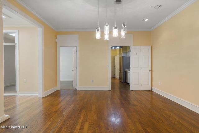 unfurnished dining area with dark wood-style flooring, ornamental molding, and baseboards