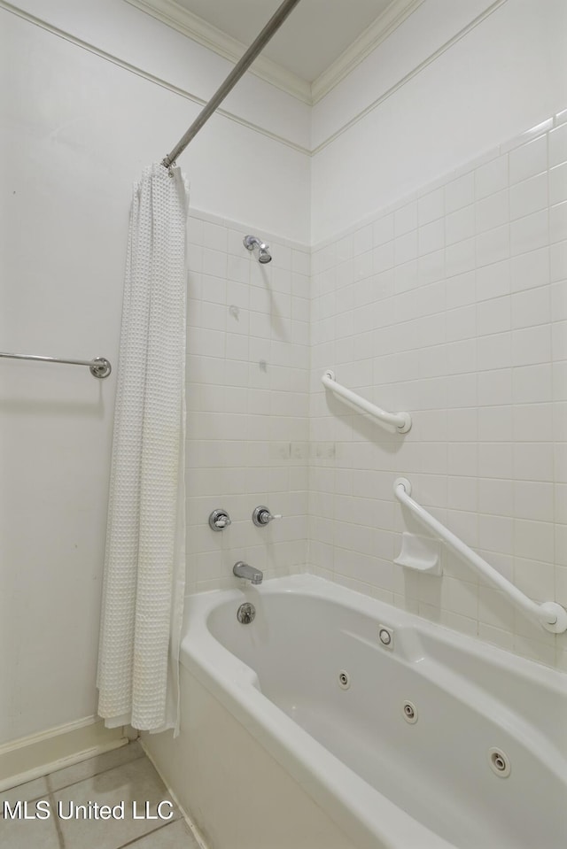 full bathroom with a combined bath / shower with jetted tub, baseboards, and crown molding