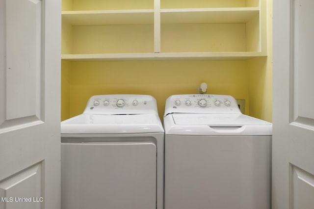 clothes washing area featuring washing machine and clothes dryer