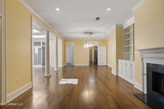 unfurnished living room featuring a premium fireplace, built in shelves, baseboards, dark wood-type flooring, and recessed lighting
