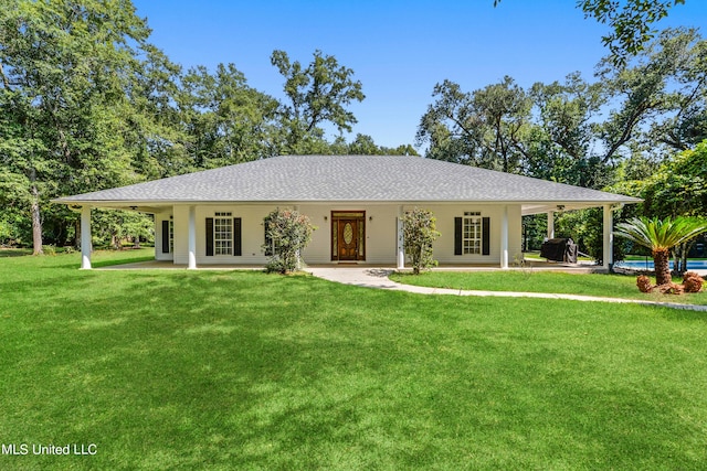 ranch-style house with a patio area, a front yard, and a swimming pool