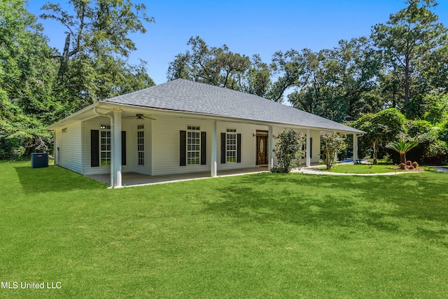 view of front of home with a front yard, cooling unit, a patio, and ceiling fan