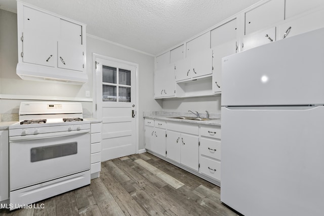 kitchen with sink, dark hardwood / wood-style flooring, a textured ceiling, white appliances, and white cabinets