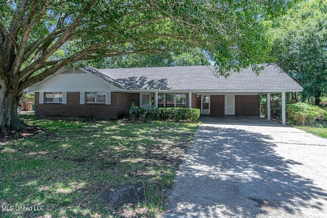 2211 Popps Ferry Rd, Biloxi, MS 39532 - single story home with driveway, brick siding, a carport, and roof with shingles