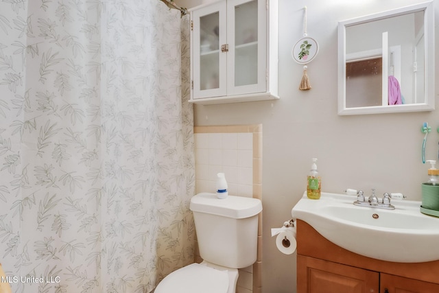 2211 Popps Ferry Rd, Biloxi, MS 39532 - bathroom featuring vanity, toilet, and a shower with curtain
