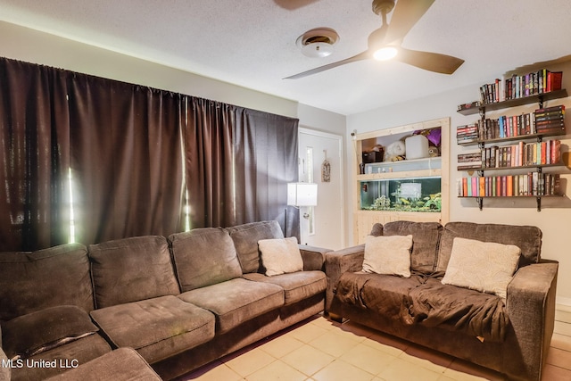 2211 Popps Ferry Rd, Biloxi, MS 39532 - tiled living room with ceiling fan and built in shelves