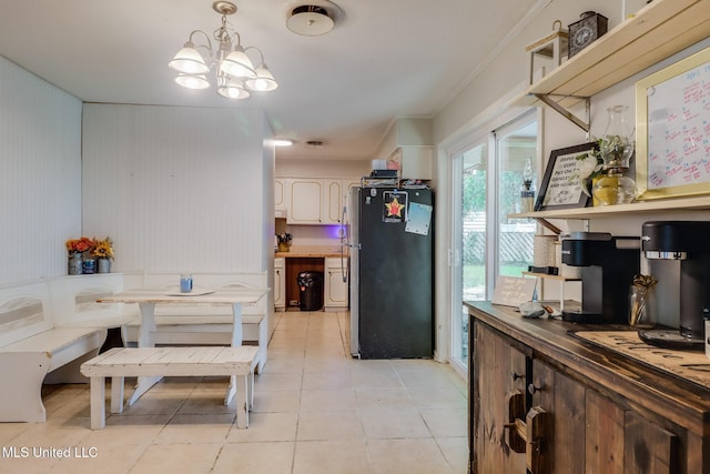 2211 Popps Ferry Rd, Biloxi, MS 39532 - dining room featuring a chandelier, light tile patterned floors, and crown molding