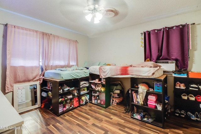 2211 Popps Ferry Rd, Biloxi, MS 39532 - bedroom featuring wood finished floors and ceiling fan