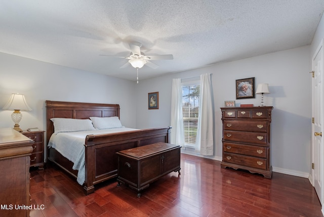 bedroom with a textured ceiling, dark hardwood / wood-style flooring, and ceiling fan