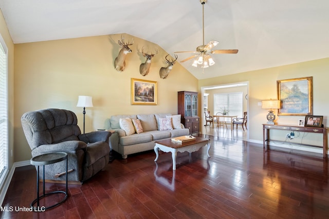 living room featuring dark hardwood / wood-style floors, ceiling fan, and lofted ceiling