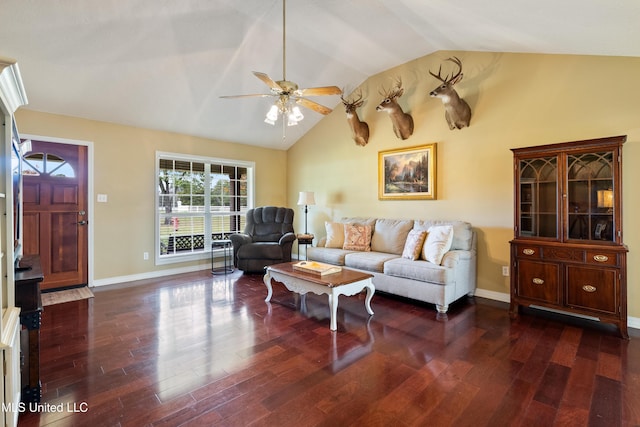 living room featuring ceiling fan, dark wood-type flooring, and vaulted ceiling