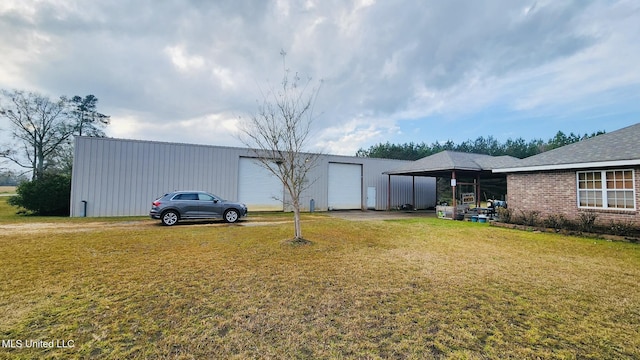 view of outdoor structure featuring a lawn and a carport