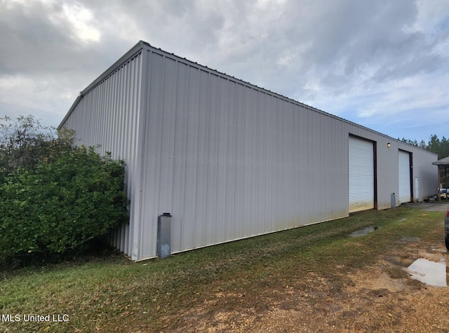 view of outbuilding featuring a garage