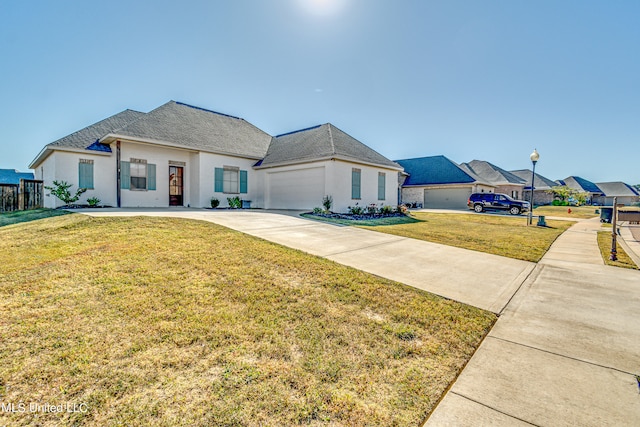 view of front of house with a front lawn and a garage